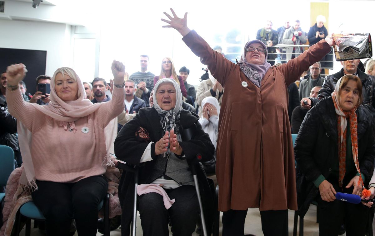 Women react as they watch a television broadcast of the court proceedings of former Bosnian Serb general Ratko Mladic in the Memorial centre Potocari near Srebrenica, Bosnia and Herzegovina, November 22, 2017. 