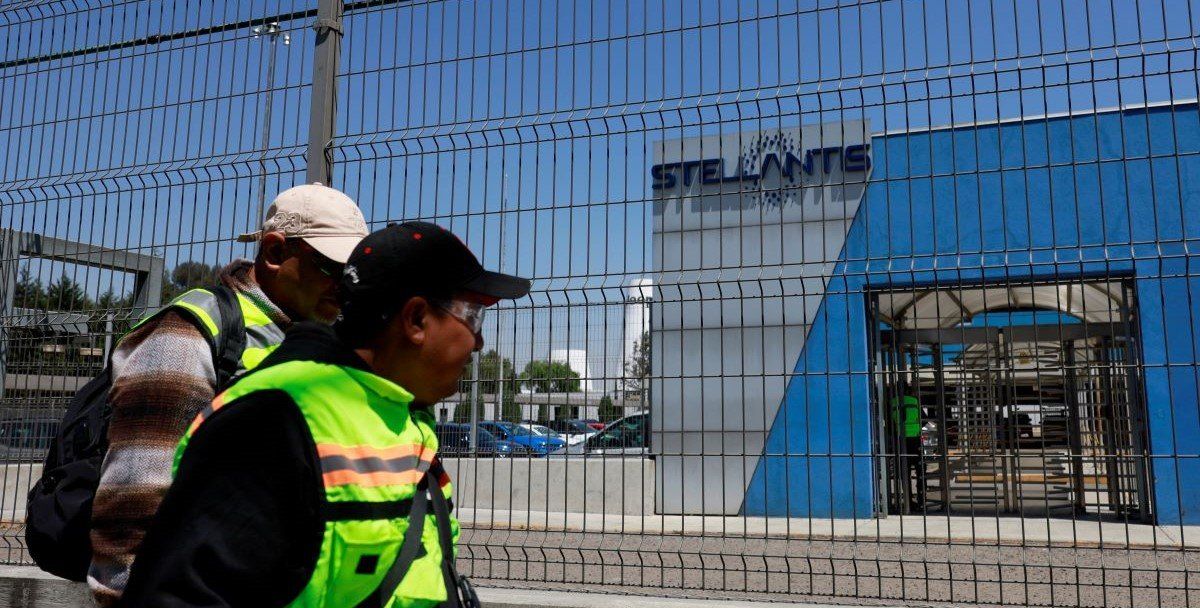 ​Workers walk outside a Stellantis assembly plant following a company's announcement saying it will pause production there, in Toluca, state of Mexico, Mexico April 4, 2025. 