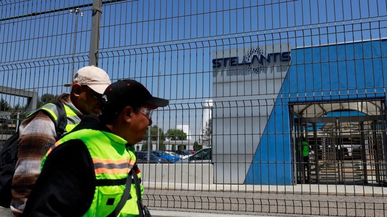 Workers walk outside a Stellantis assembly plant following a company's announcement saying it will pause production there, in Toluca, state of Mexico, Mexico April 4, 2025.