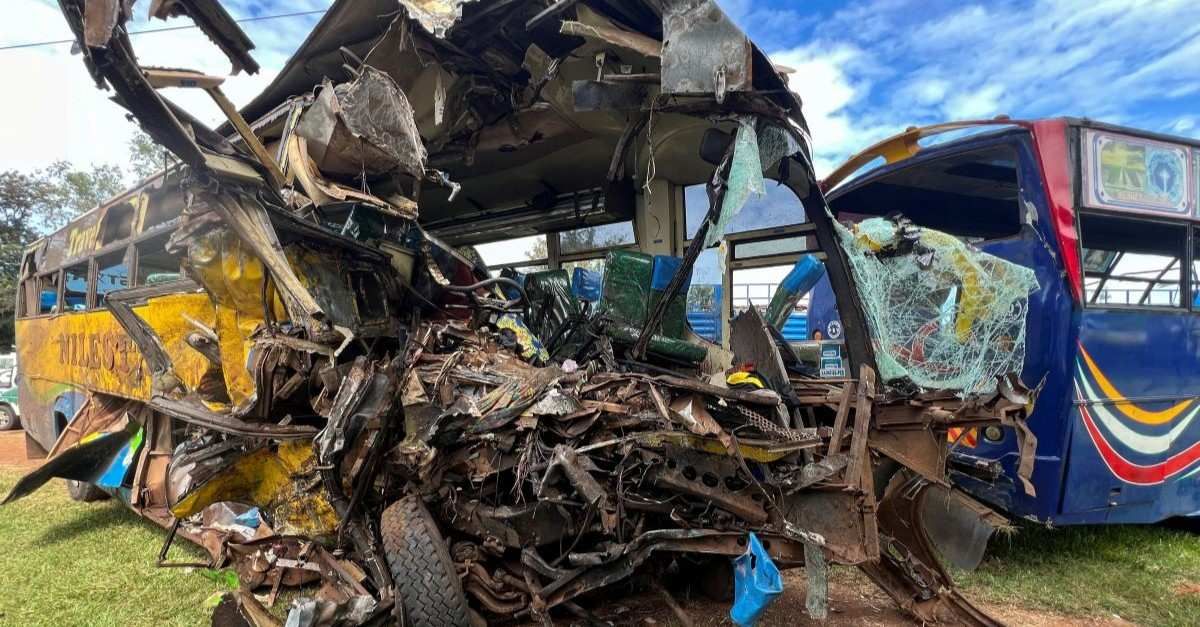 ​Wreckage of public transport buses involved in a head-on collision is parked at a police station near the scene of the deadly crash on the Kampala-Gulu highway in Kiryandongo district, near Gulu, northern Uganda, October 22, 2025. 