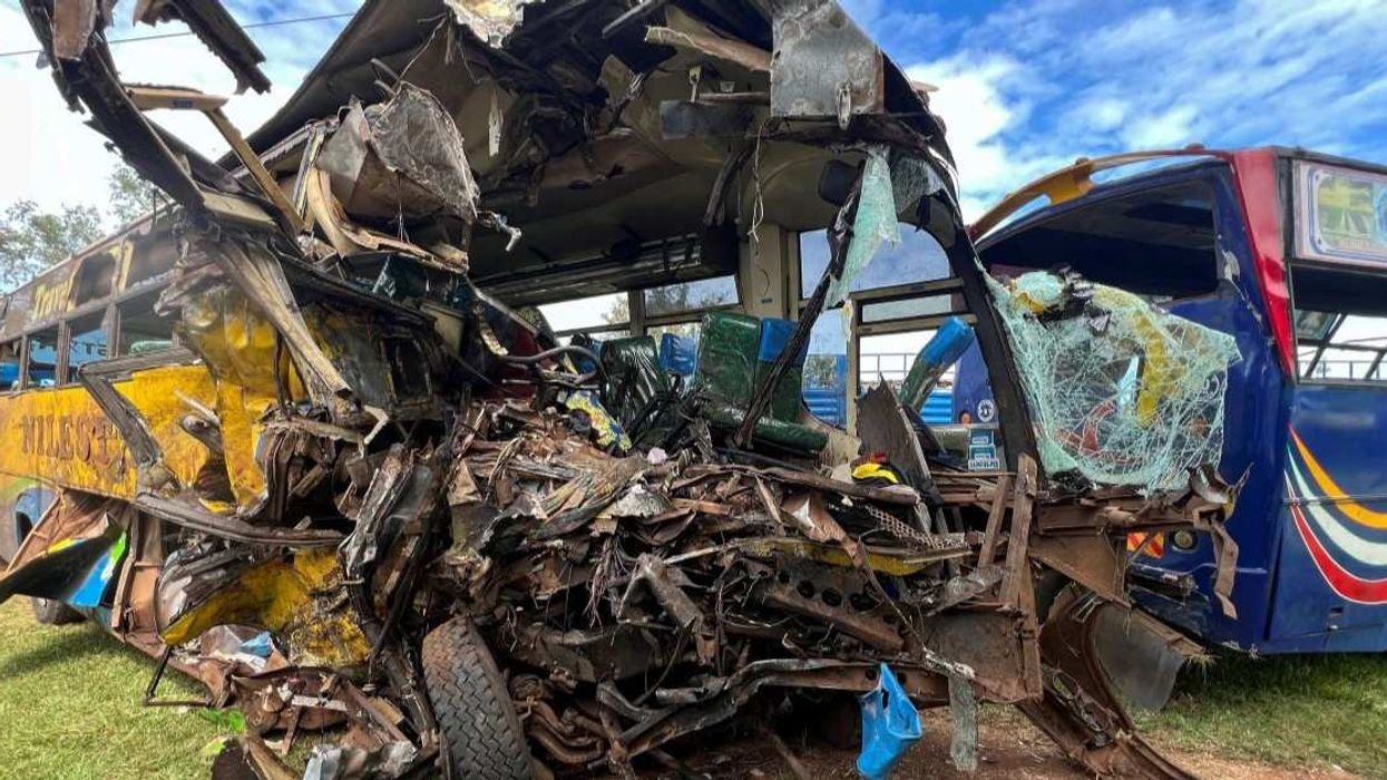 Wreckage of public transport buses involved in a head-on collision is parked at a police station near the scene of the deadly crash on the Kampala-Gulu highway in Kiryandongo district, near Gulu, northern Uganda, October 22, 2025.