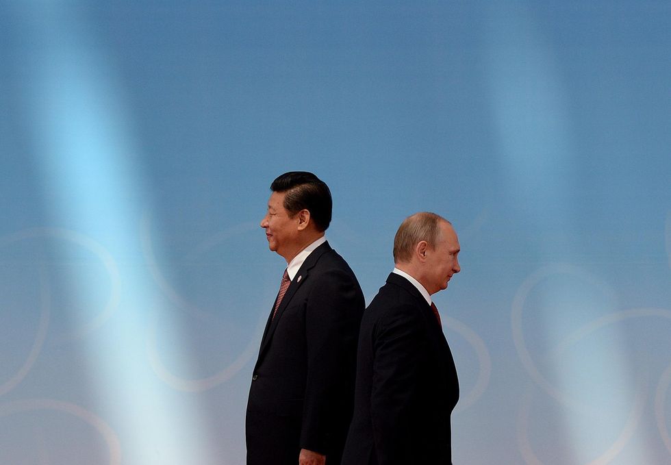 Xi (left) and Putin (right) are not attending COP26. 