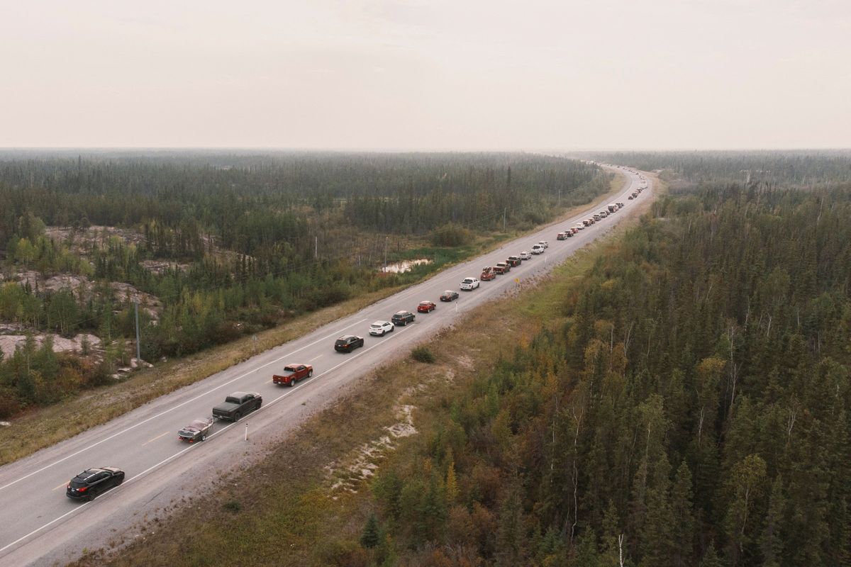 Yellowknife residents leave the city on Highway 3, the only highway in or out of the community, after an evacuation order was given due to the proximity of wildfires in the Northwest Territories.