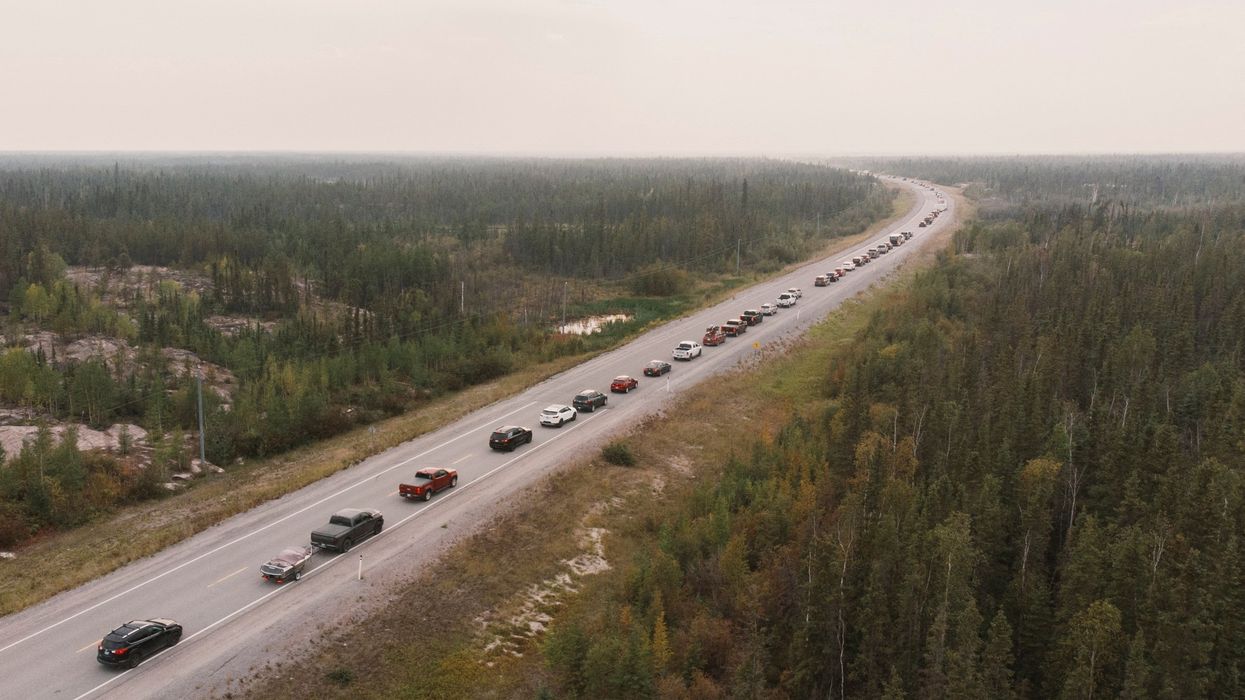Yellowknife residents leave the city on Highway 3, the only highway in or out of the community, after an evacuation order was given due to the proximity of wildfires in the Northwest Territories.