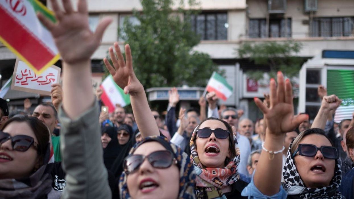 Young Iranian female protesters shout anti-U.S. and anti-Israeli slogans while participating in a protest to condemn the U.S. attacks on Iran's nuclear facilities in downtown Tehran, Iran, on June 22, 2025, amid the Iran-Israel war.